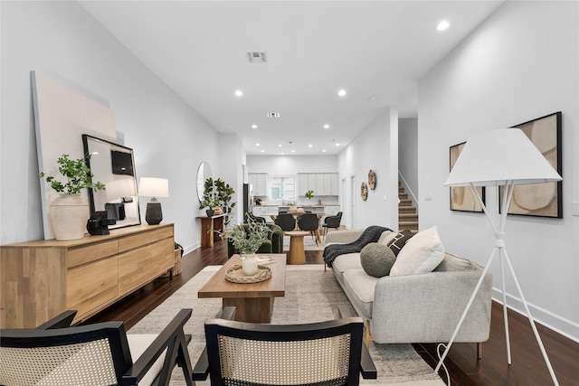 living room featuring dark hardwood / wood-style floors