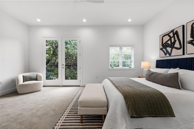 bedroom featuring access to exterior, french doors, and carpet flooring