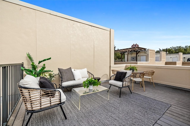 view of patio featuring a balcony and an outdoor hangout area