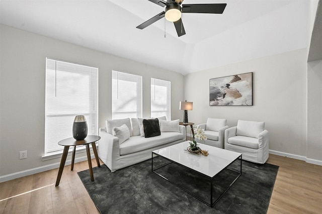 living room with wood-type flooring and ceiling fan