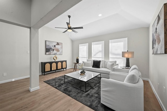 living room featuring ceiling fan, hardwood / wood-style floors, and lofted ceiling