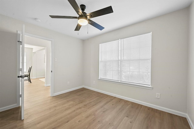 spare room with ceiling fan and light hardwood / wood-style floors