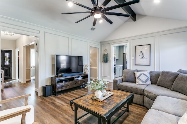 living room with dark hardwood / wood-style flooring, lofted ceiling with beams, and ceiling fan