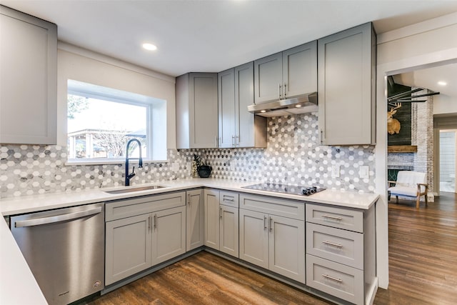 kitchen with gray cabinetry, sink, stainless steel dishwasher, dark hardwood / wood-style floors, and black electric cooktop