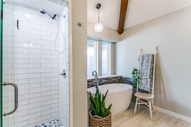 bathroom featuring hardwood / wood-style floors, beam ceiling, and independent shower and bath