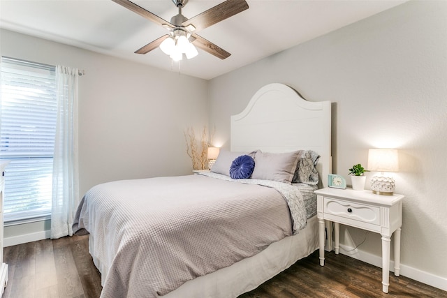 bedroom featuring ceiling fan and dark hardwood / wood-style floors