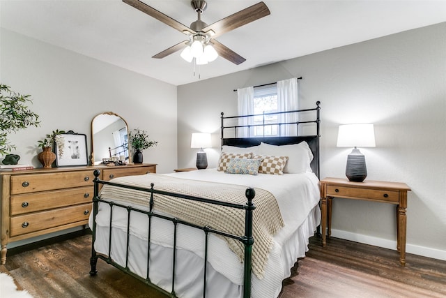 bedroom with ceiling fan and dark wood-type flooring