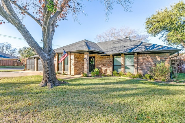 ranch-style home with a garage and a front yard