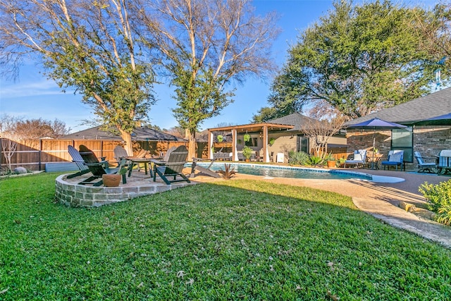 view of yard with a fenced in pool and a patio