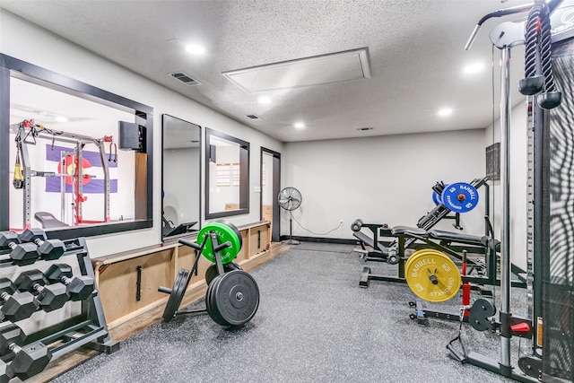 exercise area with a textured ceiling