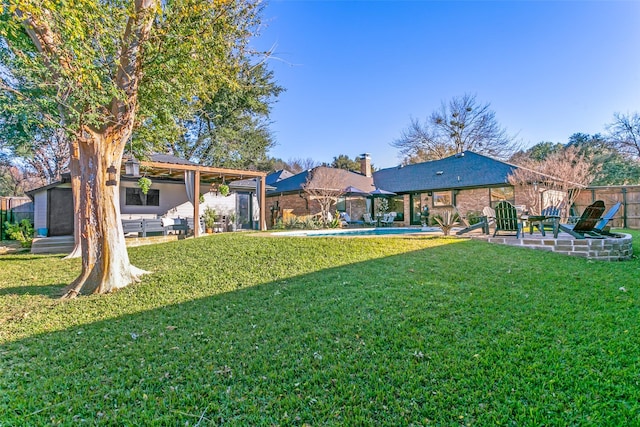 view of yard featuring a fenced in pool and a patio