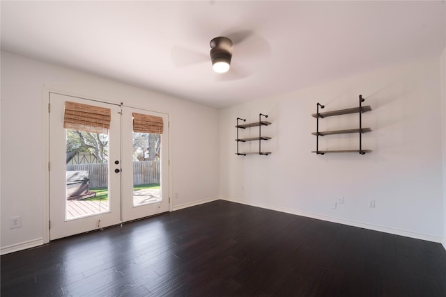 spare room featuring ceiling fan, french doors, and dark hardwood / wood-style floors