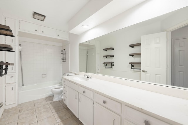 full bathroom featuring tile patterned floors, vanity, toilet, and tiled shower / bath combo