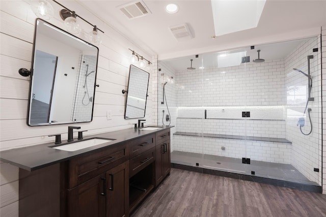 bathroom featuring hardwood / wood-style floors, vanity, and an enclosed shower