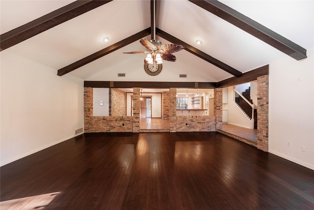 unfurnished living room featuring ceiling fan, wood-type flooring, and brick wall