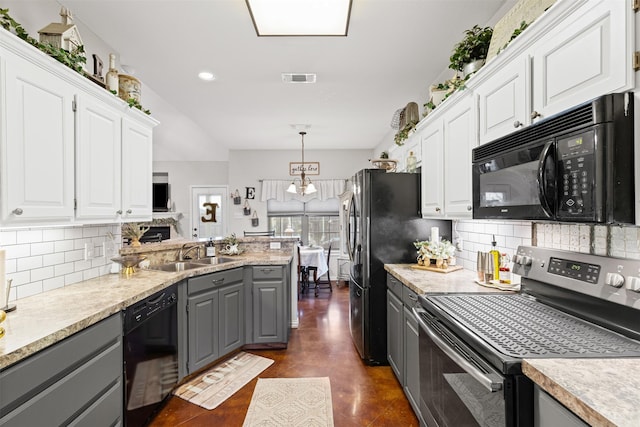 kitchen with sink, black appliances, pendant lighting, white cabinets, and gray cabinets