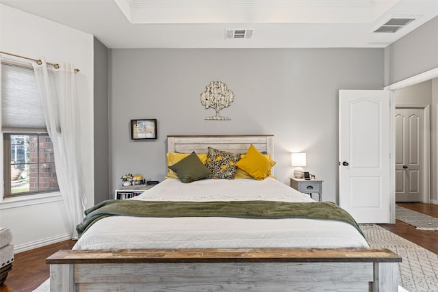 bedroom with dark wood-type flooring