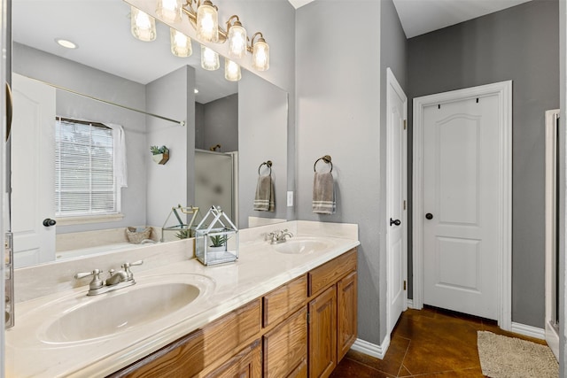 bathroom featuring tile patterned flooring, vanity, and a shower with shower door