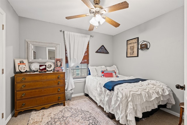 bedroom featuring ceiling fan and light carpet