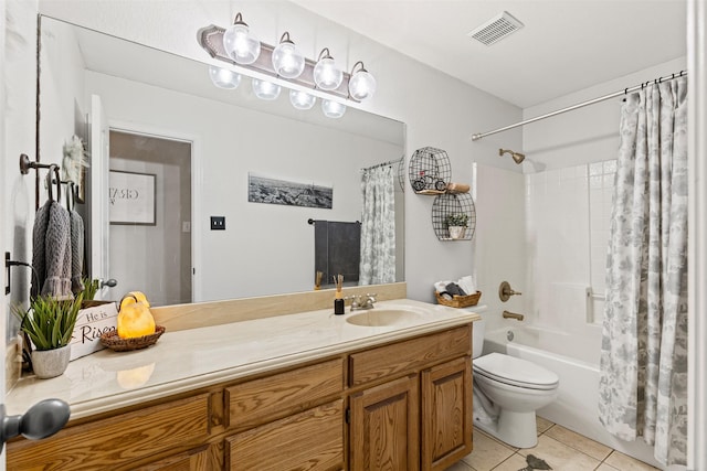 full bathroom featuring tile patterned flooring, vanity, shower / bath combo, and toilet