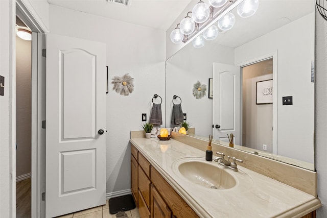 bathroom with tile patterned flooring and vanity