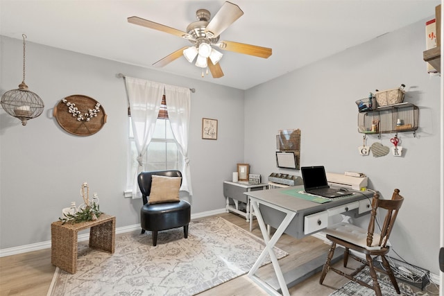 office featuring light wood-type flooring and ceiling fan