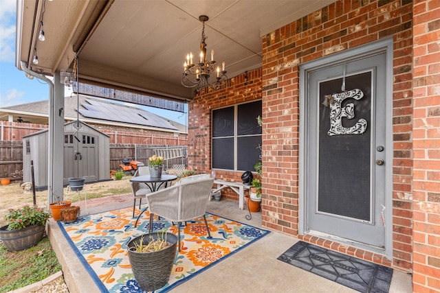 view of exterior entry with a patio