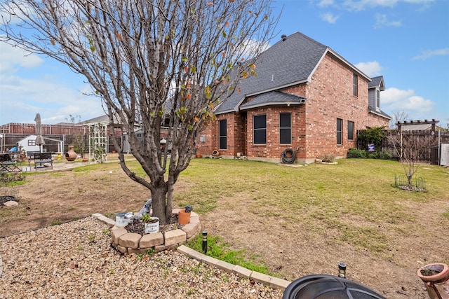 view of side of home featuring a lawn