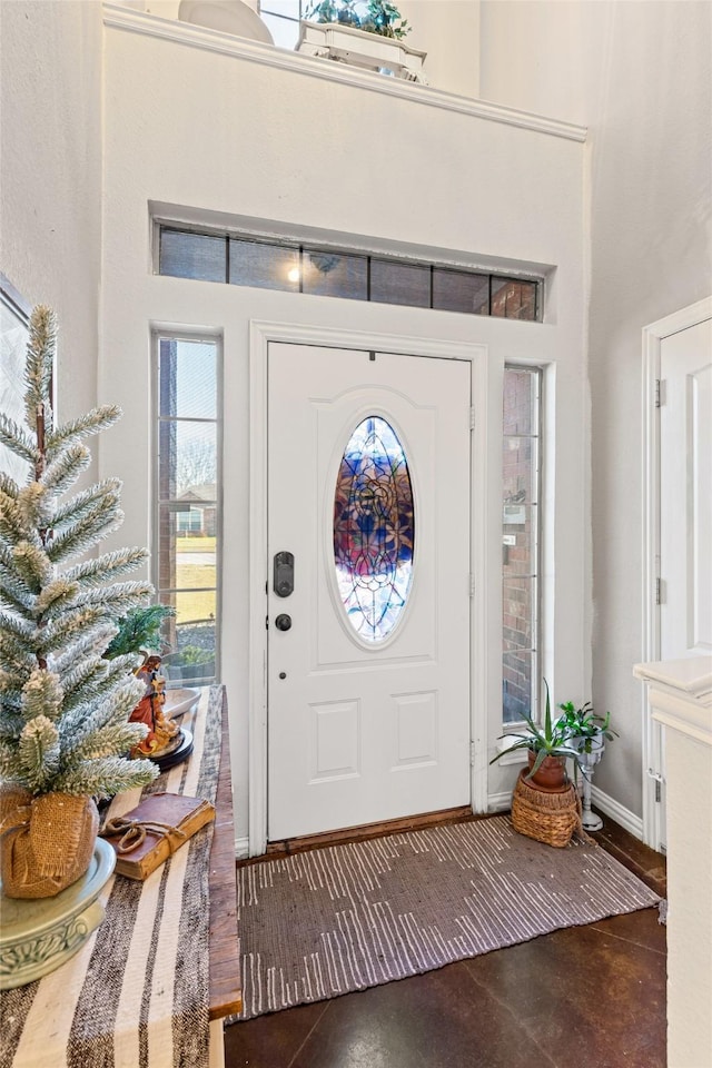 foyer entrance with a high ceiling