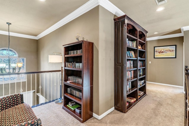 hallway featuring crown molding and light colored carpet