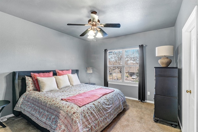 bedroom with ceiling fan and light carpet