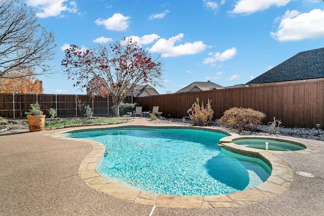 view of swimming pool with an in ground hot tub and a patio