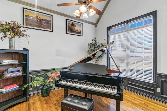 misc room with crown molding, ceiling fan, lofted ceiling, and hardwood / wood-style flooring