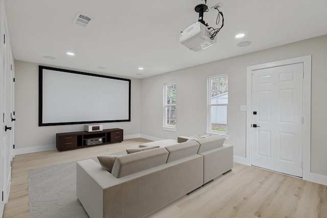 home theater room with light hardwood / wood-style flooring