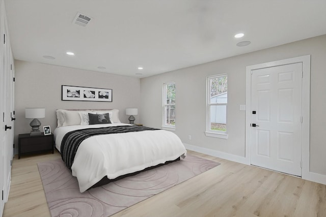 bedroom with light hardwood / wood-style floors