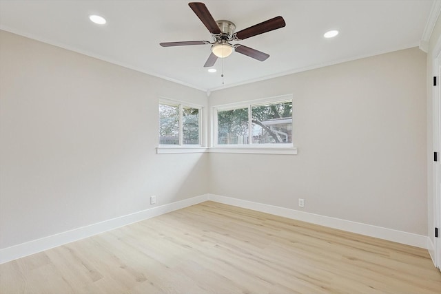 empty room featuring crown molding, ceiling fan, and light wood-type flooring