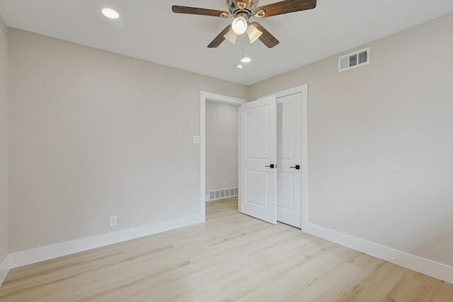 unfurnished bedroom featuring ceiling fan and light hardwood / wood-style flooring