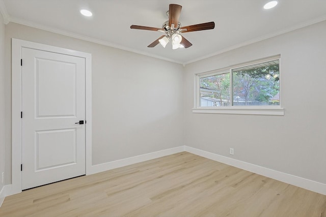 spare room with light hardwood / wood-style flooring, ornamental molding, and ceiling fan