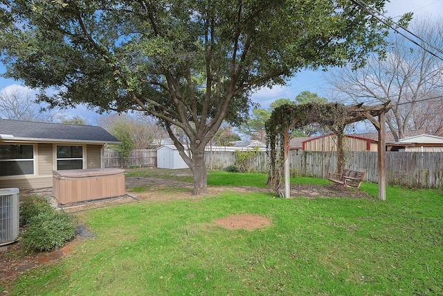 view of yard featuring cooling unit and a storage unit