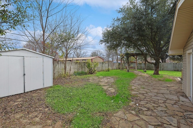 1016 Cavender Dr, Hurst, TX 76053 - view of yard featuring a storage shed, a patio, an outbuilding, and a fenced backyard