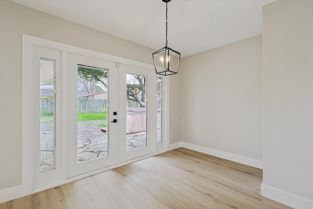 1016 Cavender Dr, Hurst, TX 76053 - doorway featuring baseboards, french doors, a chandelier, and wood finished floors