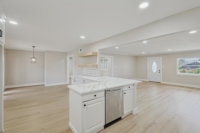 kitchen with white cabinetry, light wood-type flooring, stainless steel dishwasher, pendant lighting, and light stone countertops