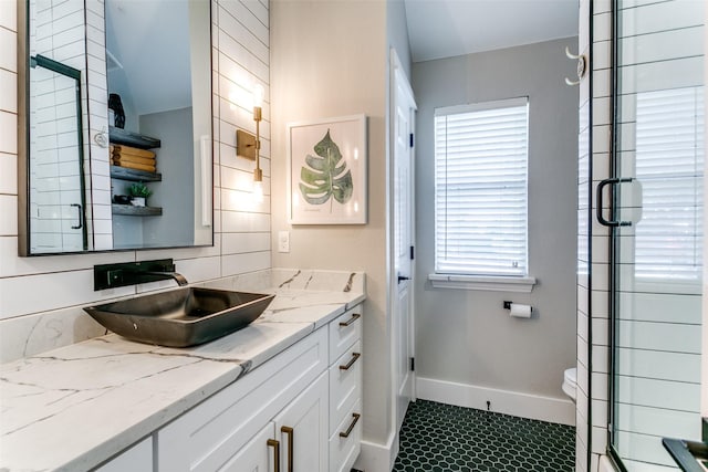 bathroom with tile patterned floors, vanity, and toilet