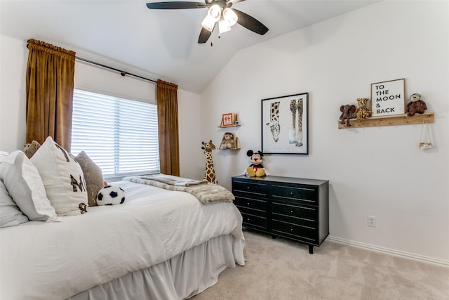 carpeted bedroom featuring vaulted ceiling and ceiling fan