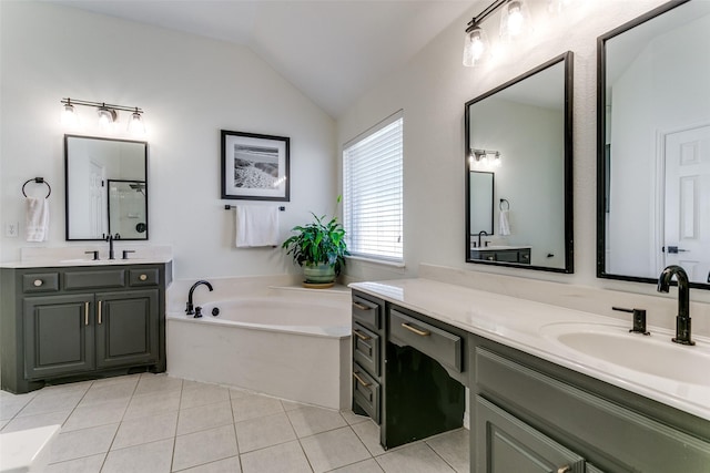 bathroom with independent shower and bath, vanity, tile patterned floors, and lofted ceiling