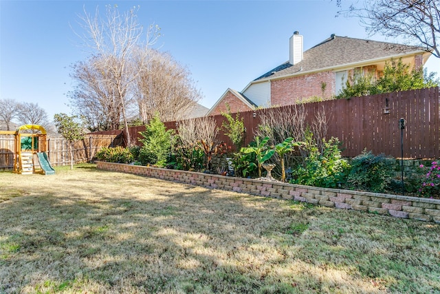 view of yard with a playground