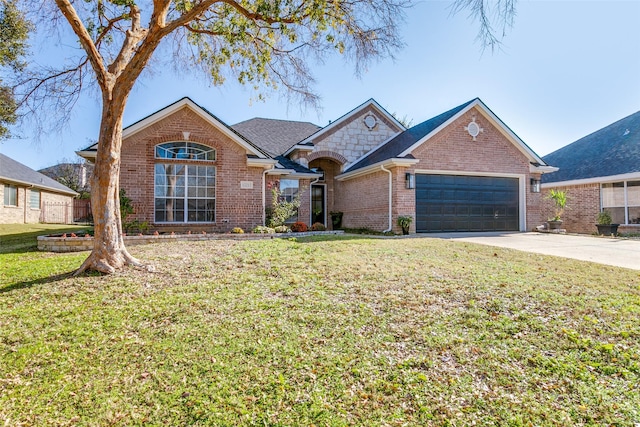 view of front facade with a garage and a front lawn