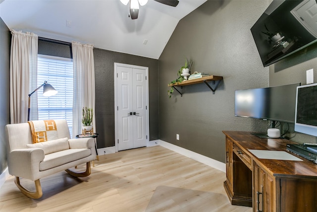 interior space with ceiling fan, light hardwood / wood-style flooring, and vaulted ceiling