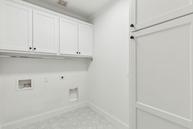 laundry area with electric dryer hookup, ornamental molding, hookup for a washing machine, and cabinets