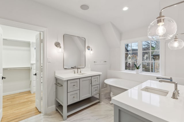 bathroom featuring a bathing tub and vanity